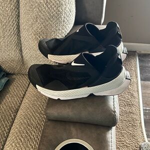 Nike Women’s Black and White Slip-On Athletic Sneakers